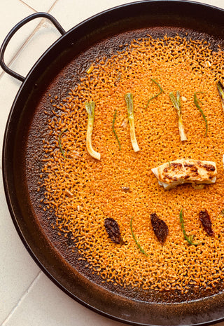 ARROZ CON  BACALAO gratinado con muselina de ajo, tomate seco y ajos tiernos